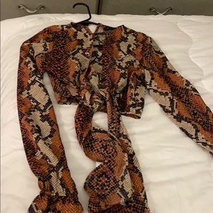 Snake skin boo hoo crop top.